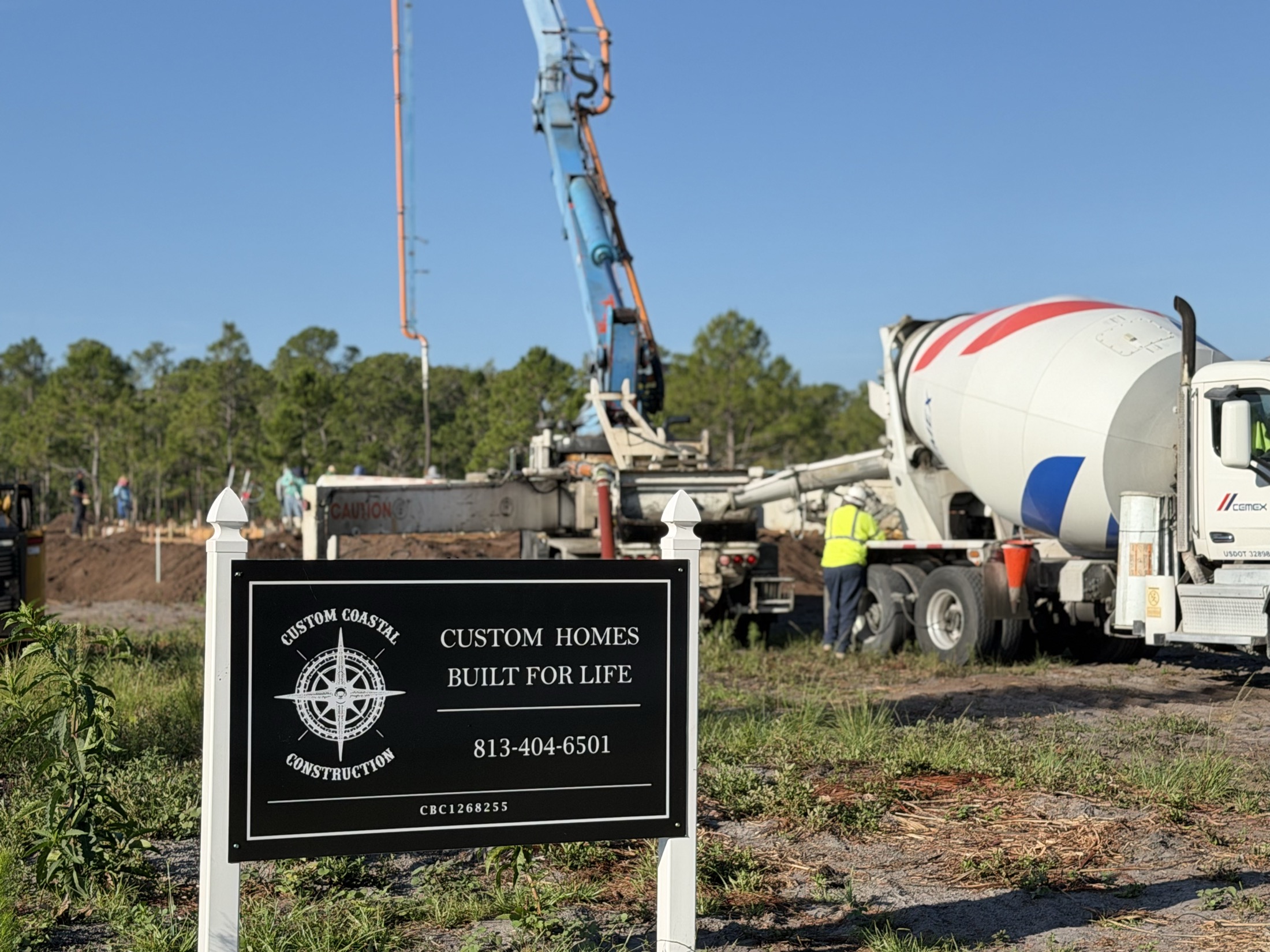 Custom Coastal Construction jobsite sign during the concrete pour